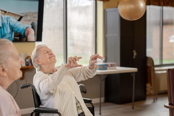 Residents engaged in a playful activity indoors
