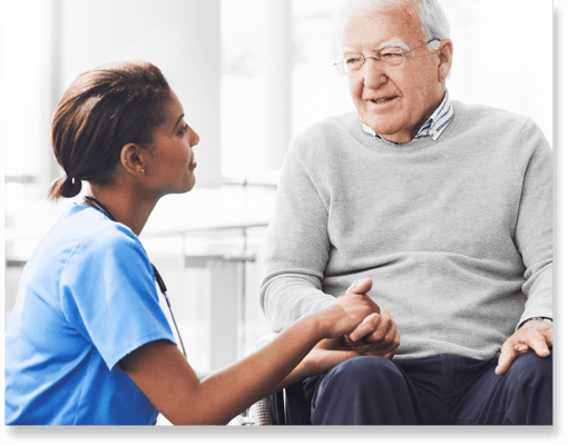 Nurse interacting with a senior resident indoors