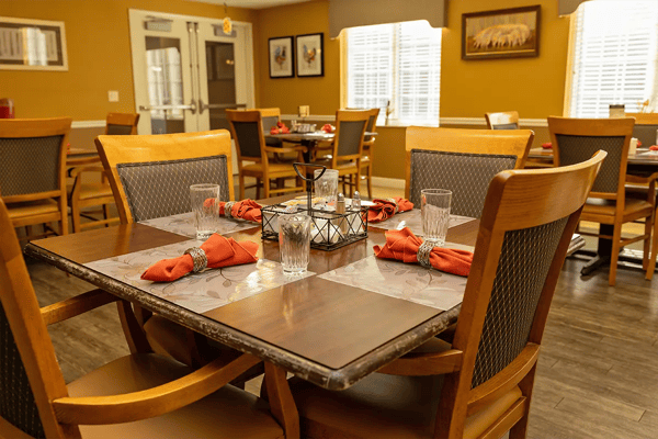 Dining area with neatly arranged table settings