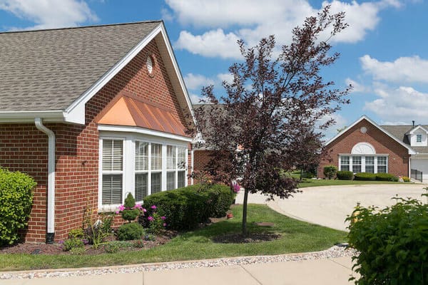 Exterior view of a brick building with landscaping