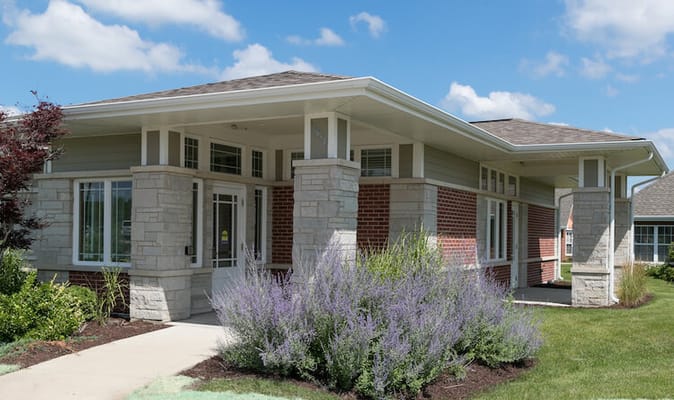Exterior view of Marian Village building with landscaping