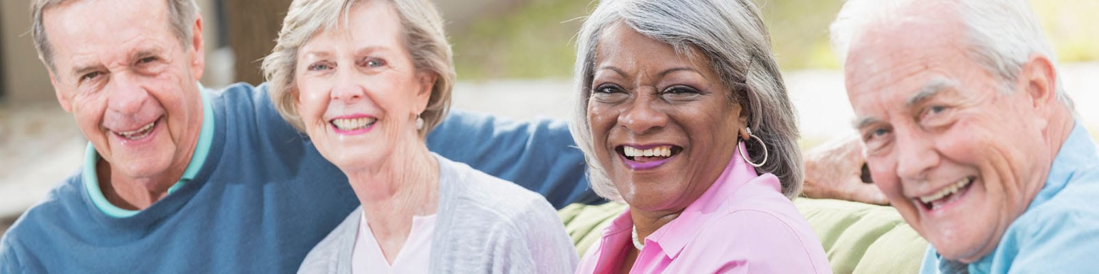 Happy seniors enjoying a sunny outdoor moment