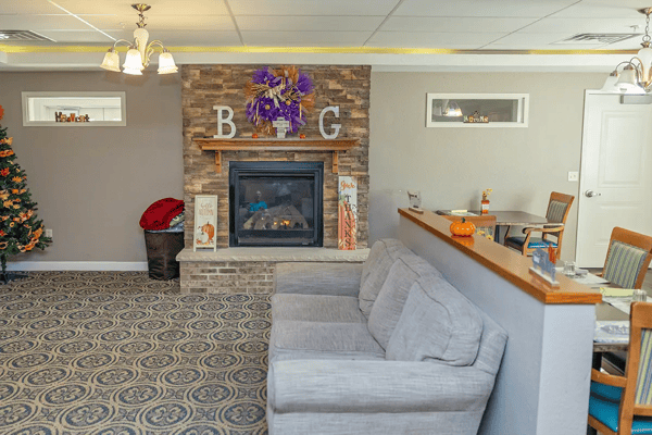 Cozy common area with a fireplace and holiday decorations