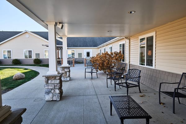 Outdoor seating area with tables and chairs