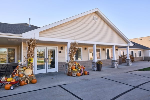 Exterior view of Emery Place decorated for fall