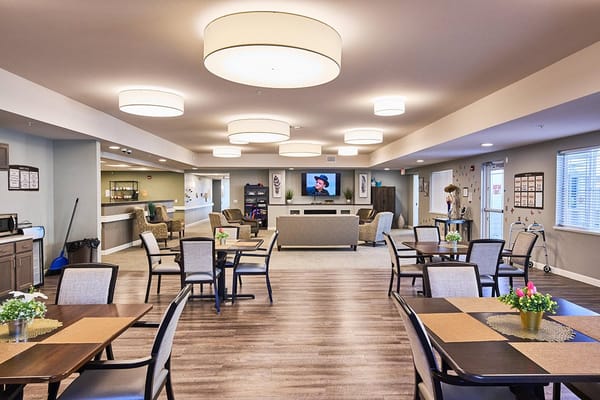 Bright common area with seating and tables