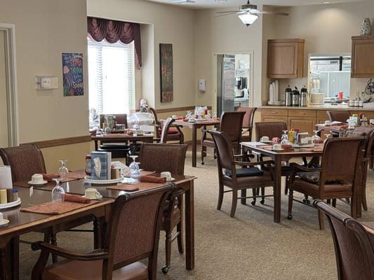 Dining room setup with tables and chairs