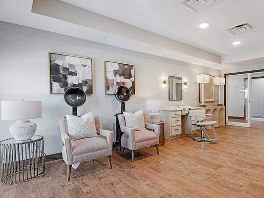 Interior photo of a hair salon area with styling chairs