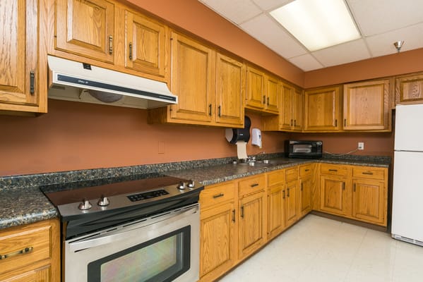 A well-equipped kitchen with wooden cabinets