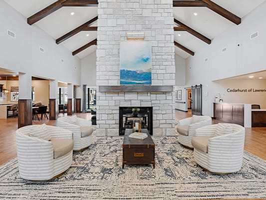 Welcoming lounge area with comfortable seating and decorative fireplace