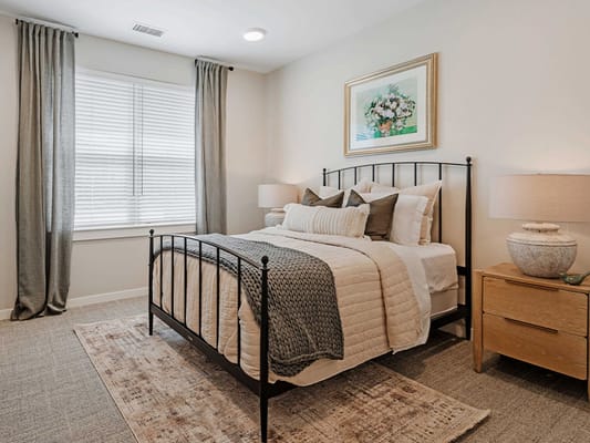 Cozy interior bedroom with a nicely made bed