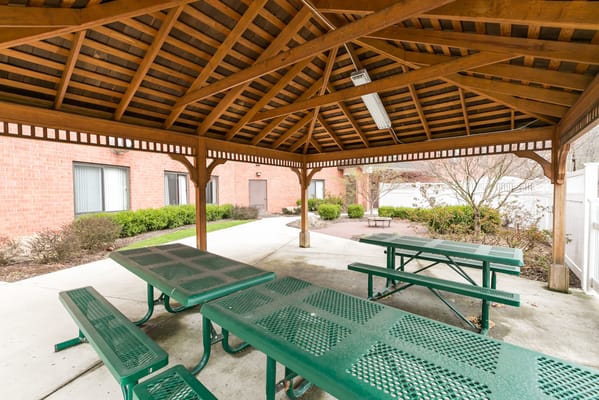 Outdoor sheltered seating area with tables