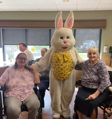 Residents enjoying a visit from an Easter bunny mascot
