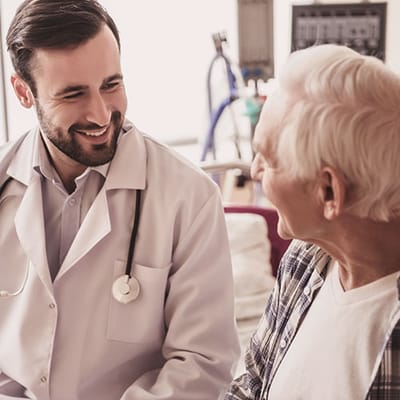 Medical professional interacting with a senior resident