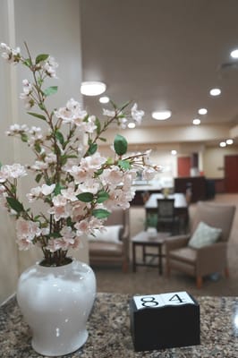 Interior view featuring decorative flowers in a common area