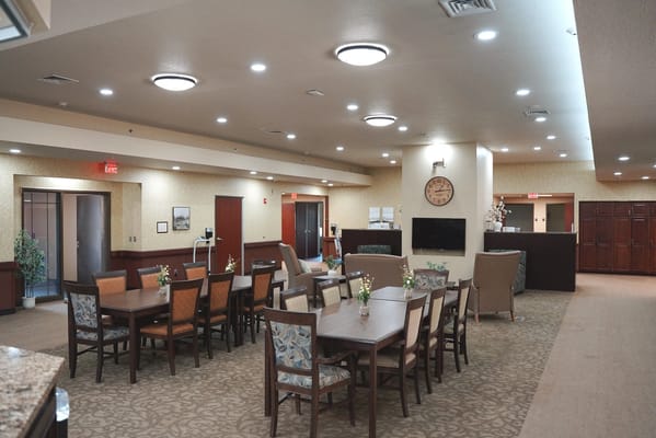 Interior view of a dining area with tables and chairs