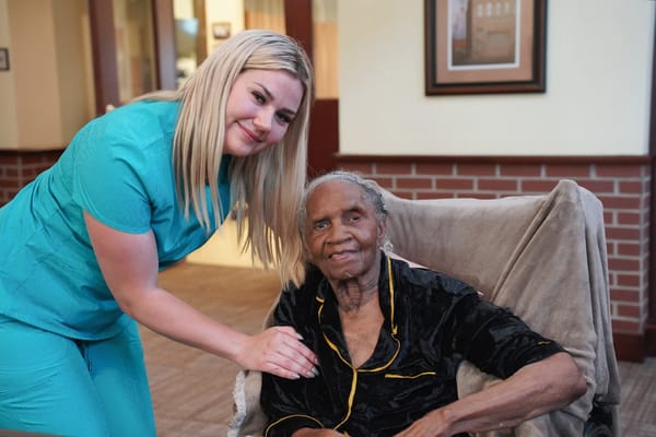 Staff member with a resident in a common area