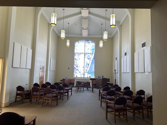 Interior view of a common area with chairs and a large window