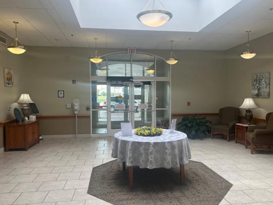 Bright lobby area with a floral centerpiece