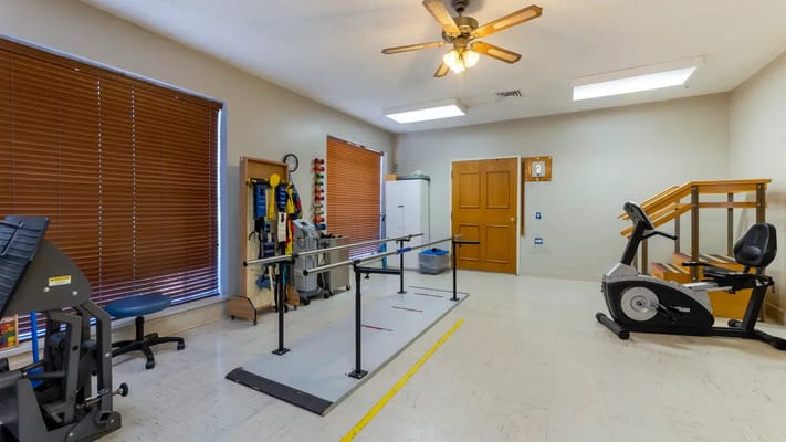 Physical therapy room with exercise equipment
