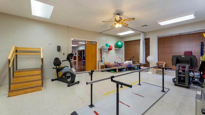 Rehabilitation room with equipment and exercise bars