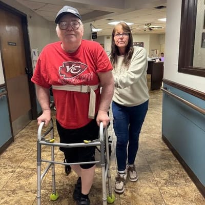 Residents interacting in a facility hallway