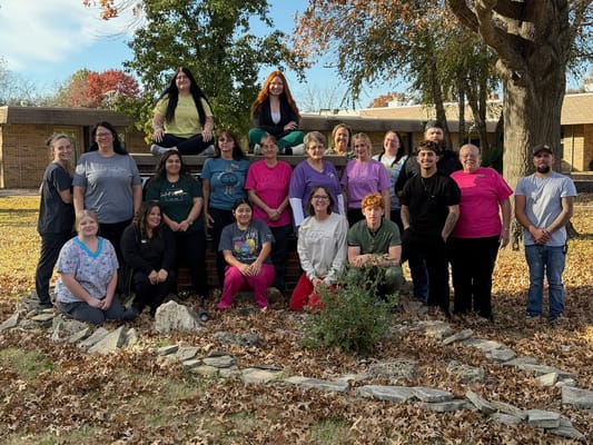Group photo of staff members in an outdoor area