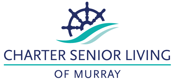 Facility logo with ship's wheel and waves design