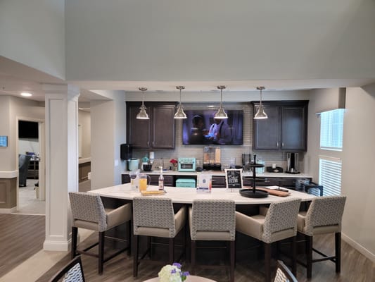 Bright interior kitchen area with seating and drinks