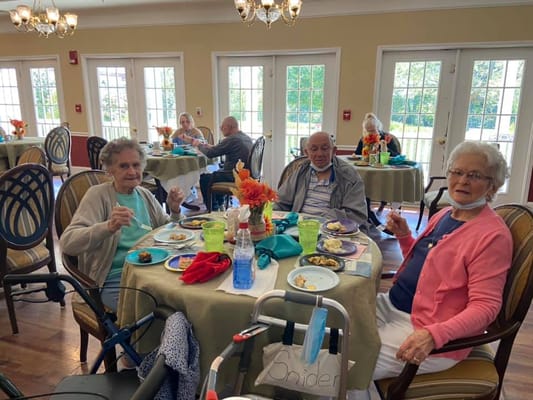 Residents enjoying a meal in the dining room