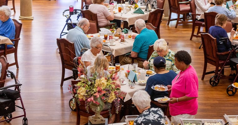 Residents enjoying meals in the dining room