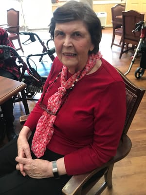 A resident sitting in a common area