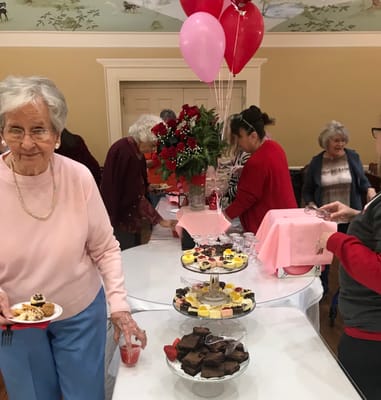 Residents celebrating with desserts and decorations