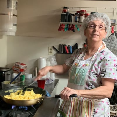 Staff member cooking in the kitchen