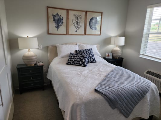 Cozy private resident room with bed and decor