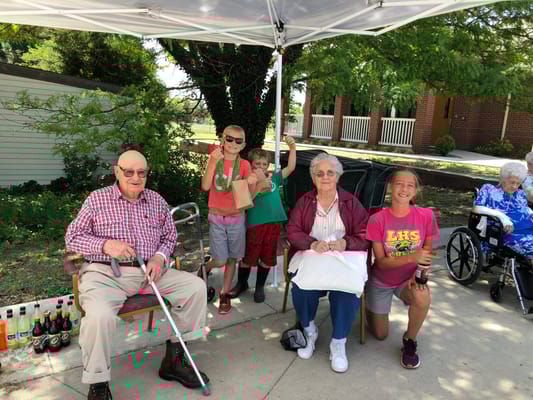 Residents enjoying an outdoor gathering with kids