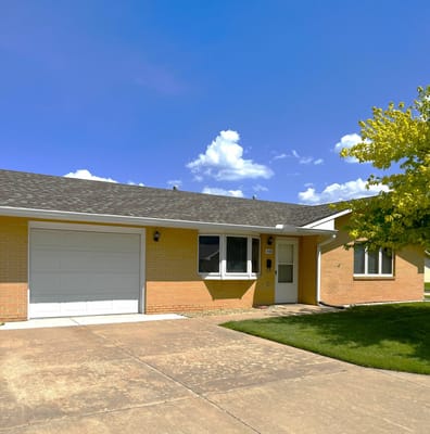 Exterior view of a residential facility with blue sky