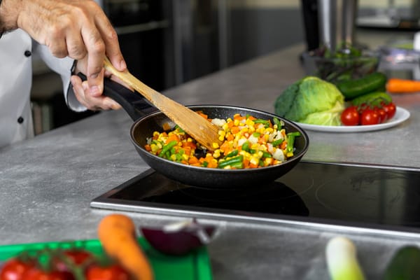 A chef preparing a colorful vegetable stir-fry in the kitchen