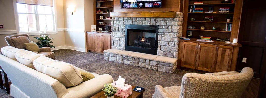 Cozy common area with a fireplace and seating