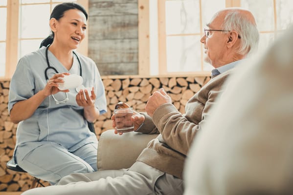 Healthcare professional talking to an elderly resident
