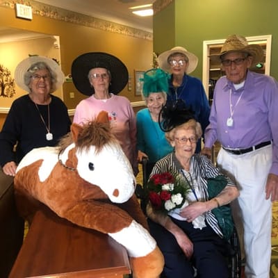 Residents enjoying a fun themed photo with hats