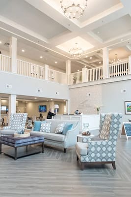 Bright common area with stylish furniture and decorations