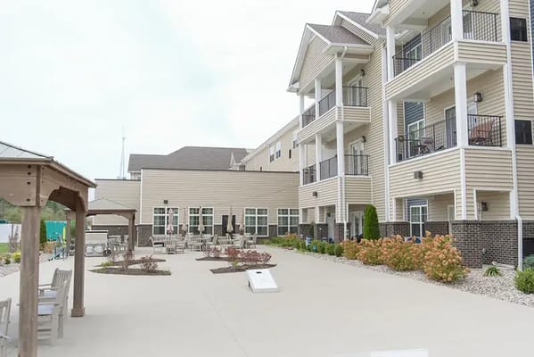Exterior view of Calumet Trace Senior Living with patio area