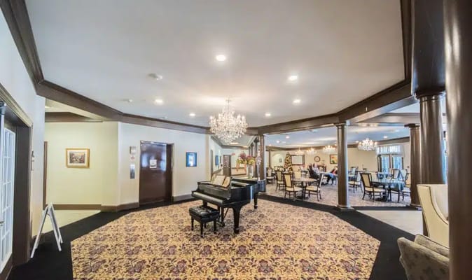 Spacious common area with piano and seating