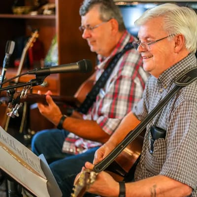 Two residents playing music together
