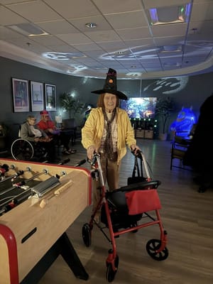 Resident wearing a witch hat in a common area