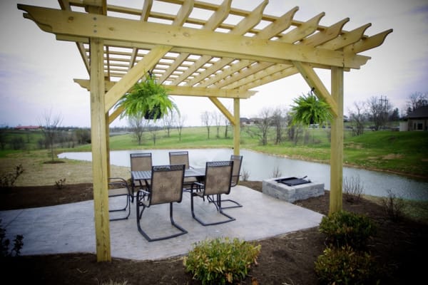 Outdoor seating area by a serene pond