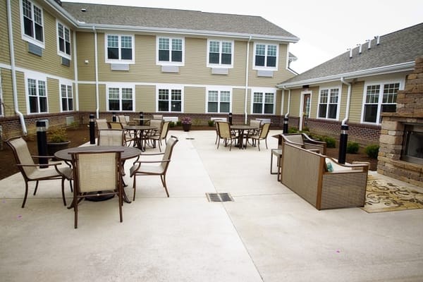 Outdoor seating area with tables and chairs
