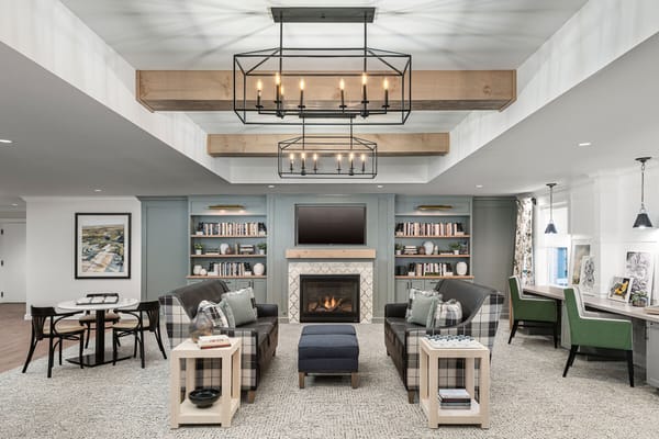 Interior common area with seating and a fireplace