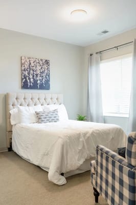 Bright and cozy resident bedroom with decor